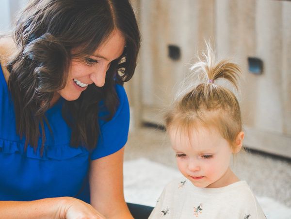 Photo of speech therapist working with one young child. 