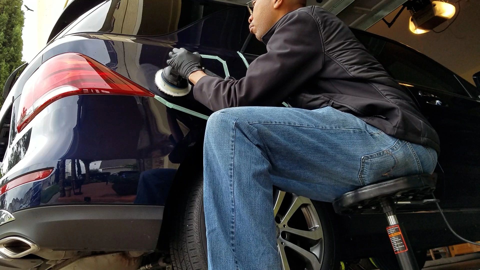 Rodney Tatum polishing a Mercedes in the city of Alachua, FL.