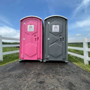 Gray and Pink Portable Toilet on a farm.
