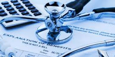 A stethoscope and syringe on medical documents and a calculator.