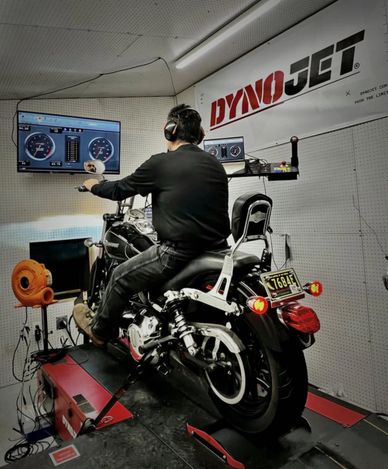 Person testing a motorcycle on a Dynojet dynamometer.