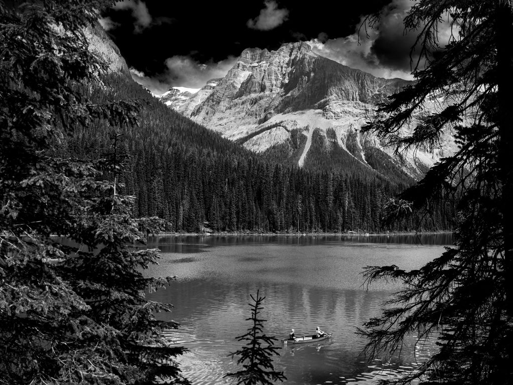 High contrast, black and white image of Emerald Lake and Canada's Rocky Mountains. 