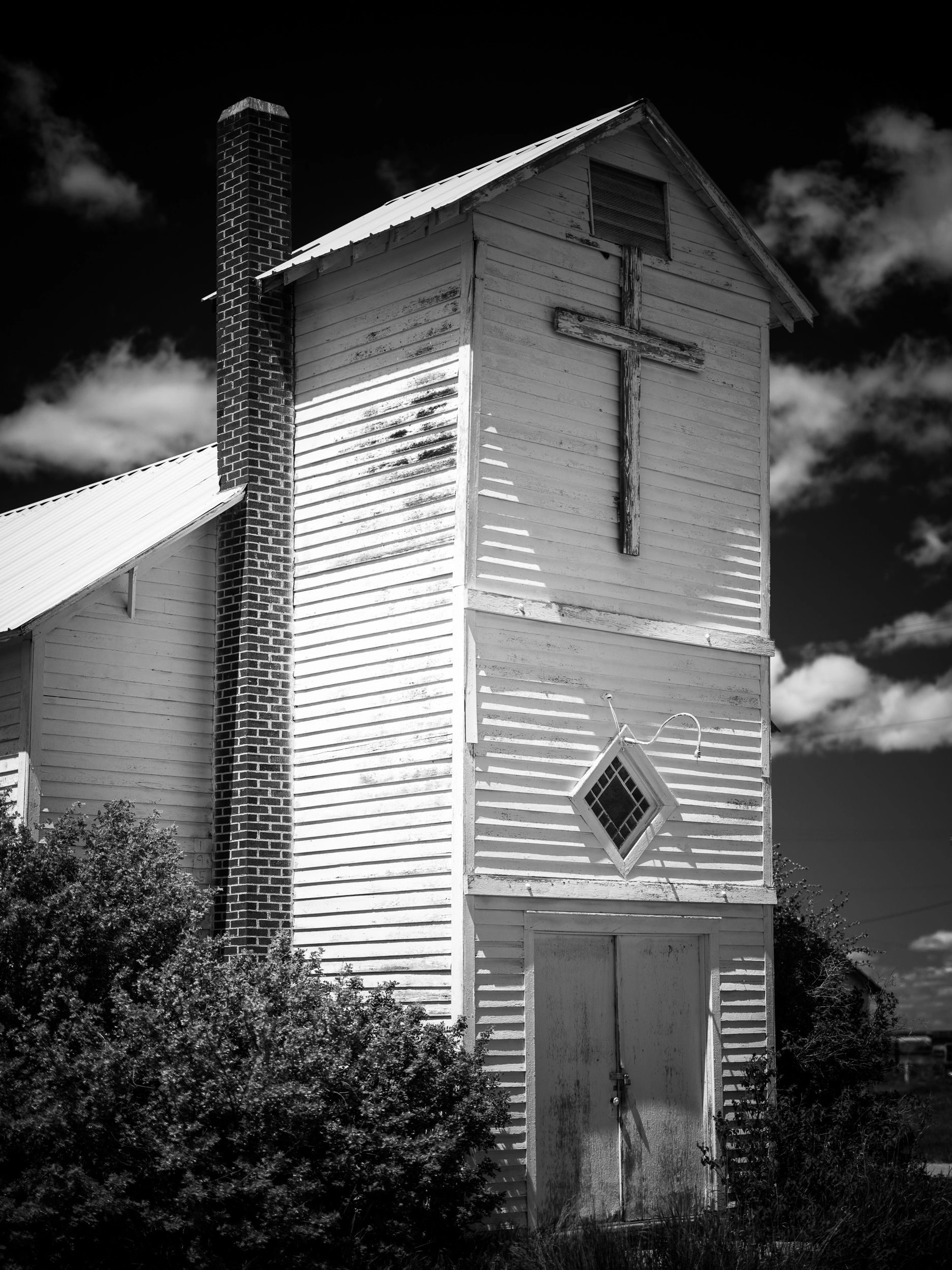 Black and white image of an old church in Moccasin, Montana, USA. 