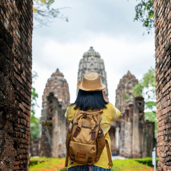 A traveler explores ancient temple ruins.