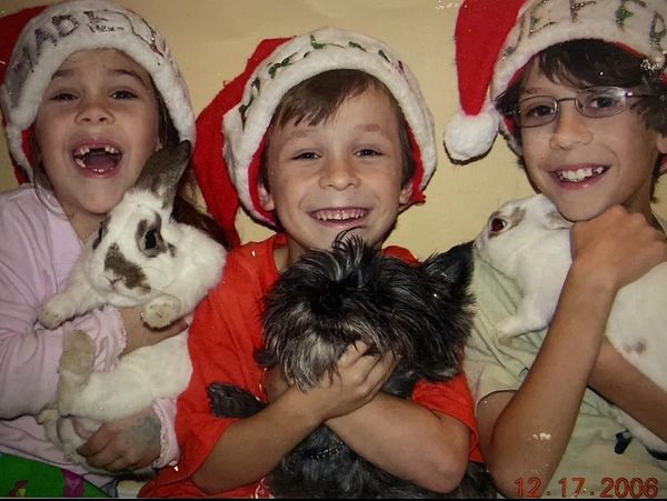 My brothers and I with our bunnies, Jack and Annie, and our dog, Sasha.