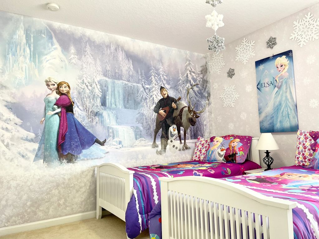 Disney themed bedroom with two twin beds located on the second floor
