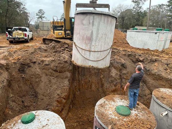 Septic tank setting using excavator 