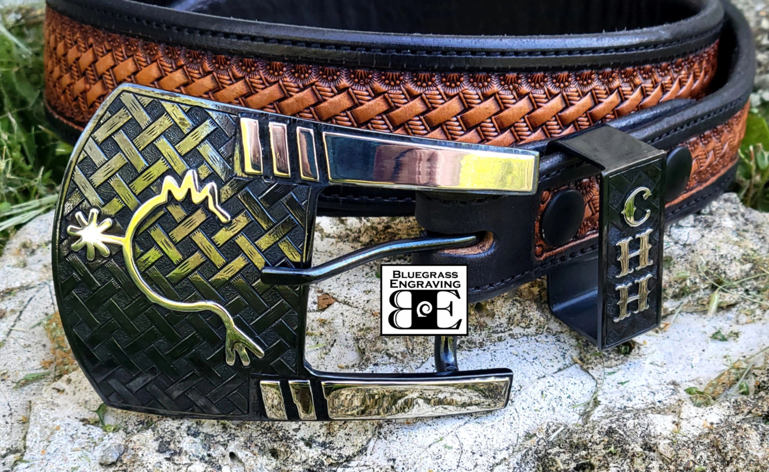 A custom two-piece ranger buckle set with brand and initials, by Bluegrass Engraving. 