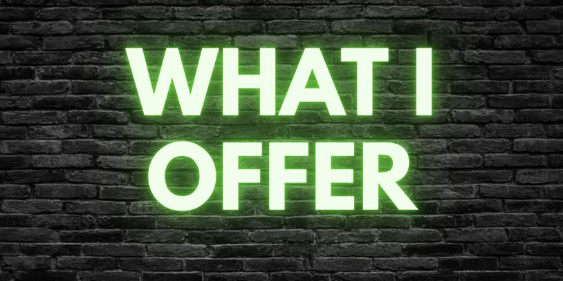 Bright neon sign reading 'WHAT I OFFER' on dark brick wall.