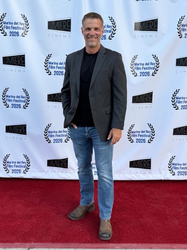 Man posing on red carpet at Marina del Rey Film Festival 2026.
