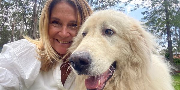Fitness instructor outside with dog