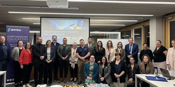 Group photo of educators at a professional event focused on AI in education.