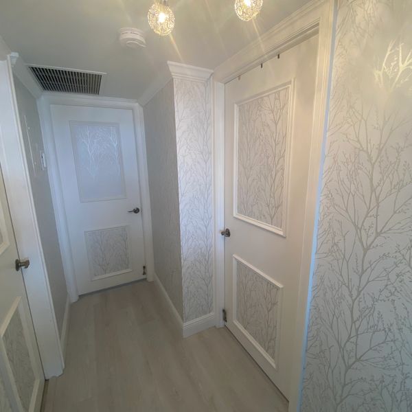Custom Embossed Boxes And Wallpaper On These Flat Doors, Completely Transitioned This Hallway