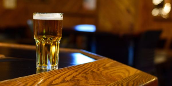 Glass of beer on a bar