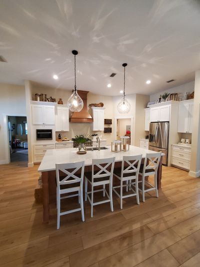 white shaker kitchen with white quartz countertops