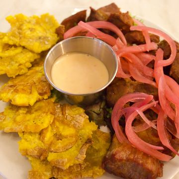 LOCAL PORK SHOULDER BITES ( CARNE FRITA) PLANTAINS FRIED (TOSTONES), PICKLED PINK ONIONS