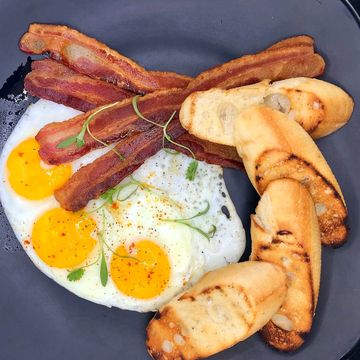 LOCAL BREAD 3 EGGS OVER EASY 4 STRIPS BACON