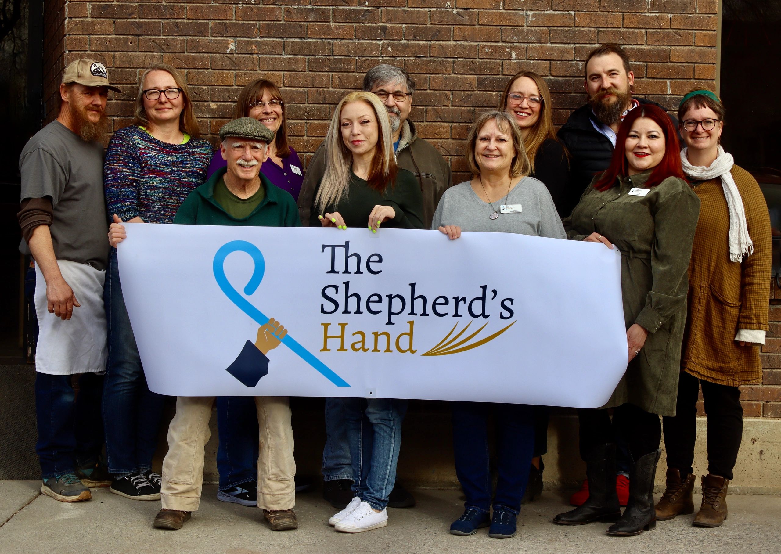 Shepherds Hand Inc logo