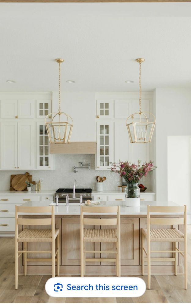 Stack of books next to pencils in a holder and a camera.