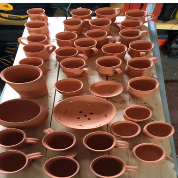 Bisque fired berry bowl and coffee mugs.