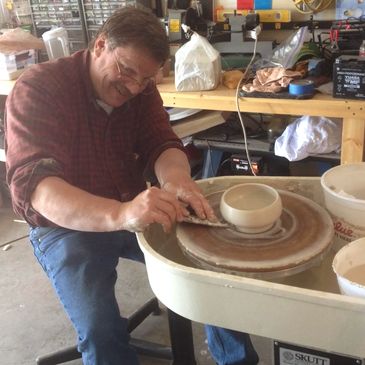 Ben in the beginning throwing porcelain bowl.