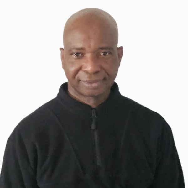 Portrait of a man in a black pullover.