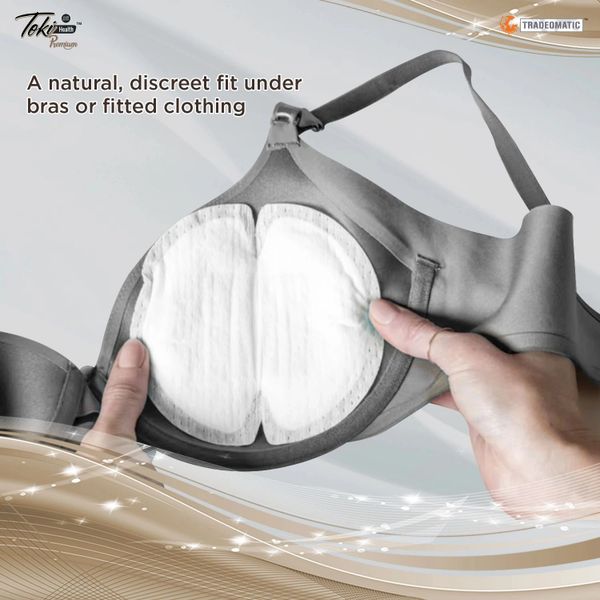 Hands holding a bra with discreet pads for natural fit under clothing.