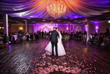 Bride and groom dancing at wedding reception.