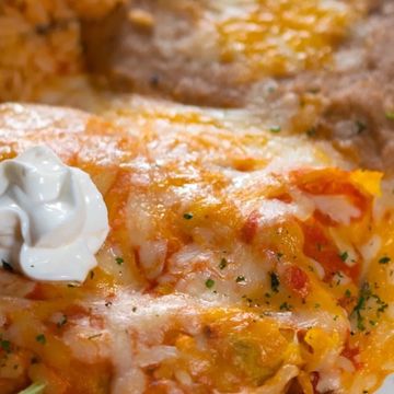 2 corn tortillas stuffed with Mexican Cheese, ground beef or shredded chicken covered with our speci