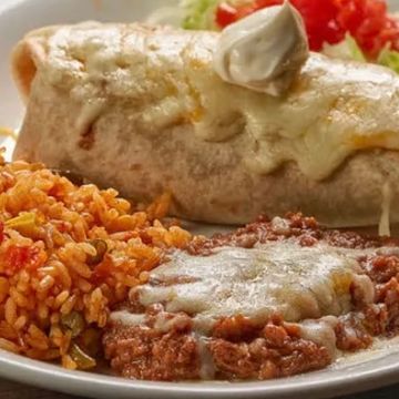 A flour tortilla stuffed with a spread of refried beans and your choice of ground beef, shredded chi