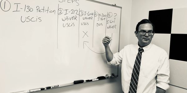 Attorney Christopher Chaney providing immigration legal advice to a client during a consultation.