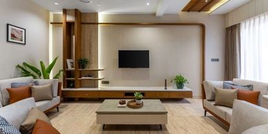 Modern living room with neutral tones and wooden accents.