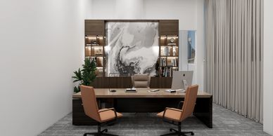 Modern office with brown chairs and abstract wall art.