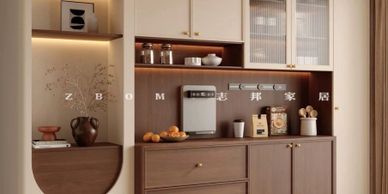 Modern kitchen cabinetry with warm wood tones and integrated appliances.