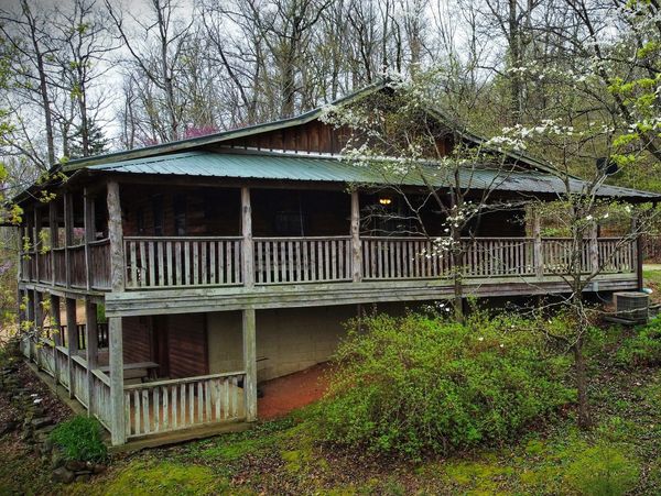 A two-story cabin in the woods