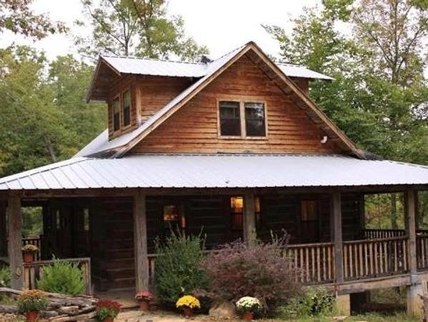 A two-story cabin in the woods
