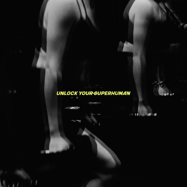 Black and white image of a person exercising with text 'UNLOCK YOUR SUPERHUMAN'.