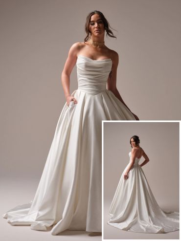 Elegant strapless white wedding gown with a flowing skirt and subtle draping.