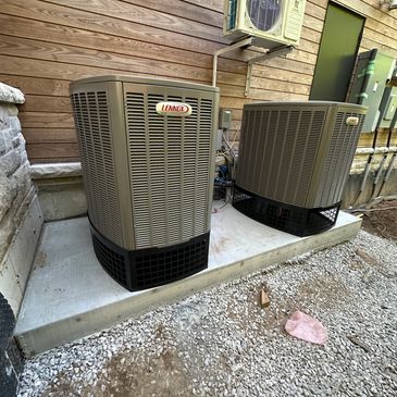 Lennox air conditioners on Concrete pad