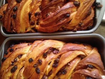 Twisted cinnamon raisin bread baked in loaf pans
