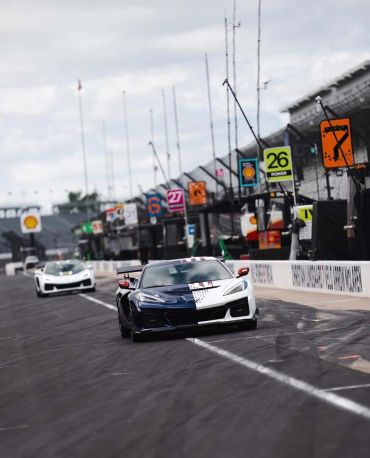 Two sports cars racing on a track.