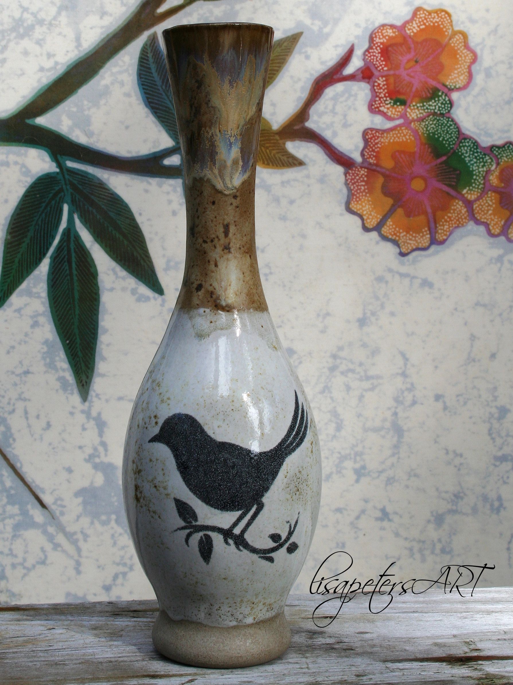 Ceramic vase with bird design.