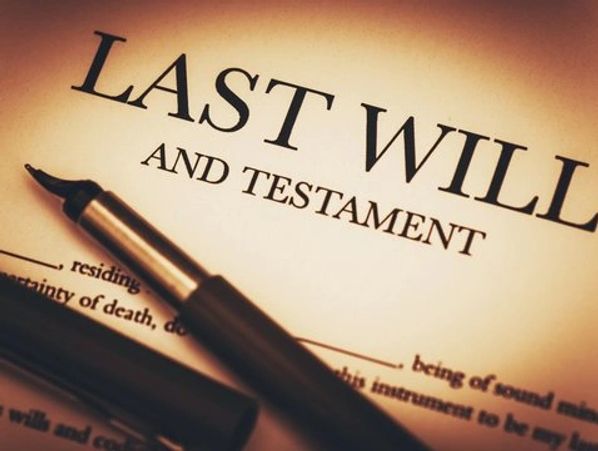A fountain pen on a last will and testament document.