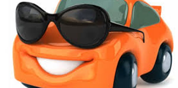 Cute orange toy car wearing large black sunglasses with a big smile.