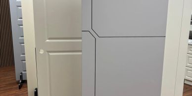 Various doors displayed upright on stands indoors.
