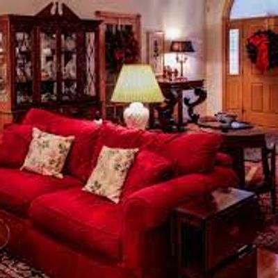 Red colour sofas in house