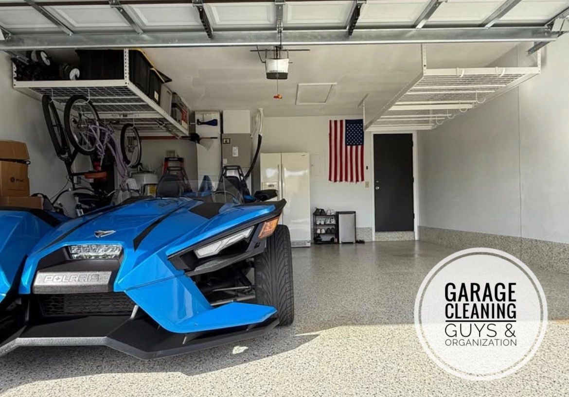 Durable polyaspartic garage flooring installation in a spacious 2-car garage with overhead racks