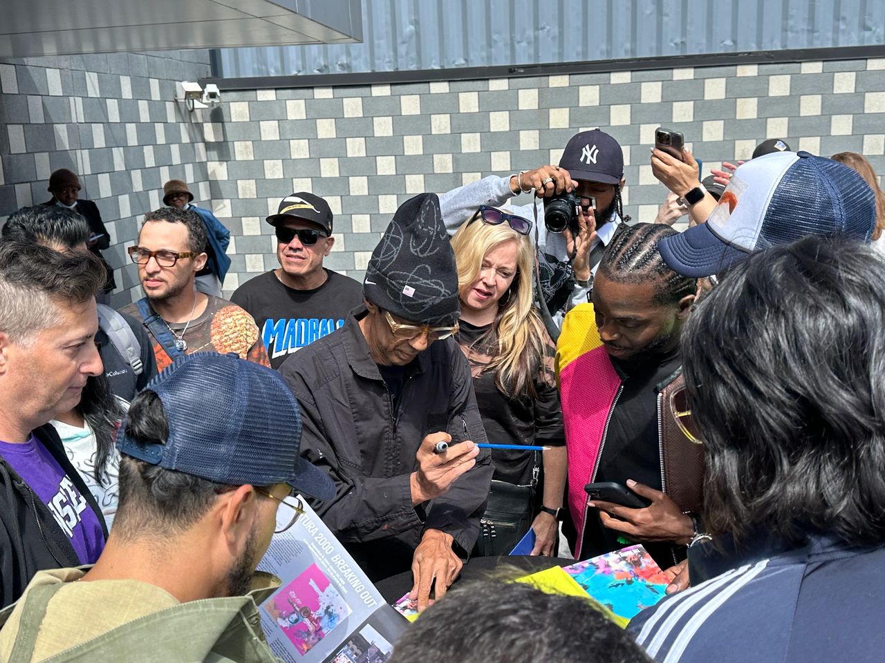 Futura signing fans' merchandise at The Bronx Museum. Photo: Youmna Sukkar