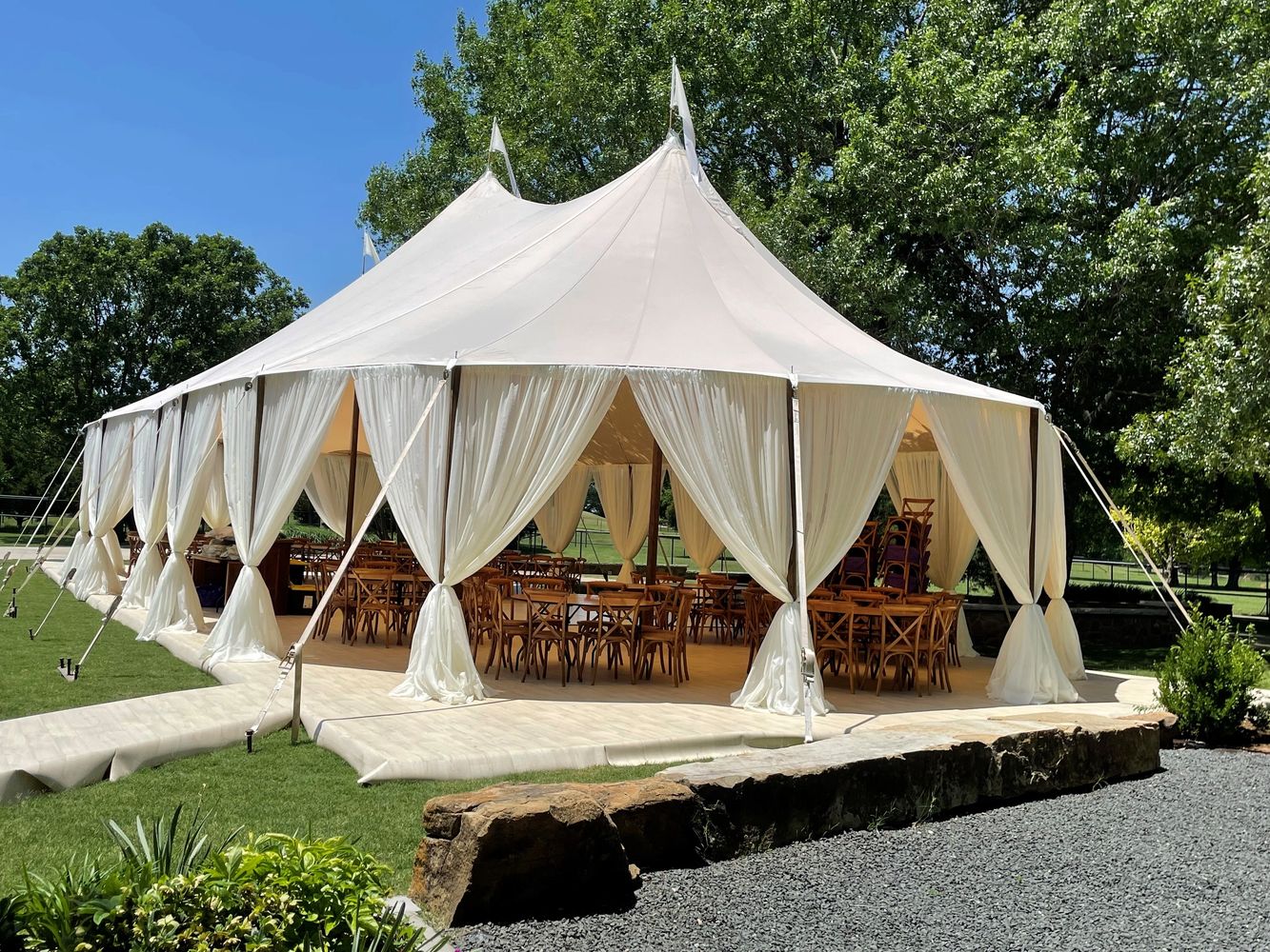 Sperry Tent with Sheer Drapes for a wedding ceremony in the Texas Hill Country.
