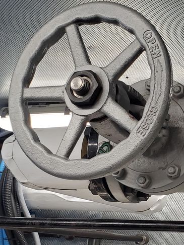 Industrial valve wheel for controlling flow in a pipe system.